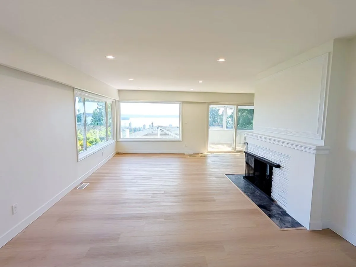 Bright, updated living room with new flooring and paint