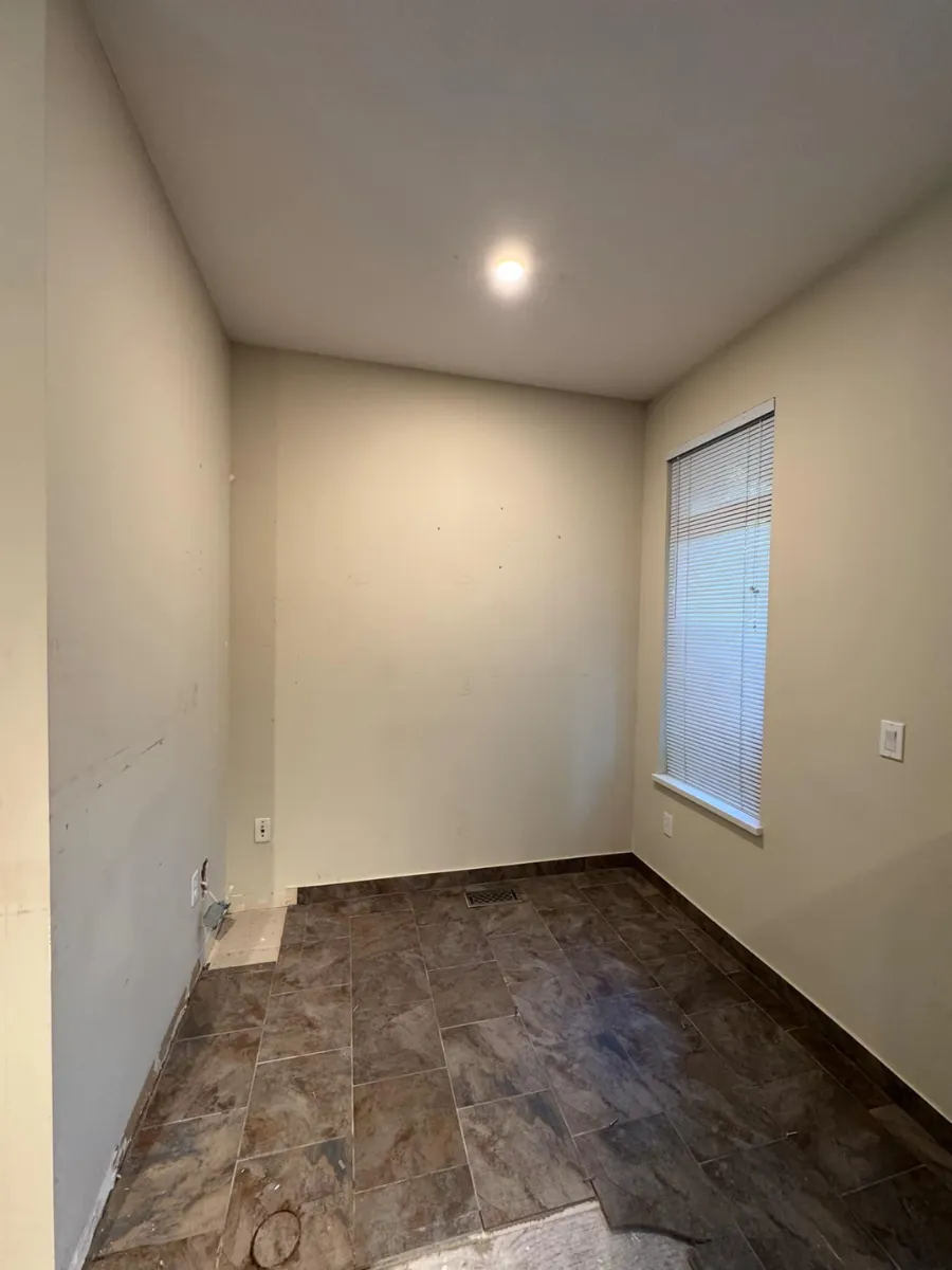 Kitchen before renovation, focusing on the old backsplash