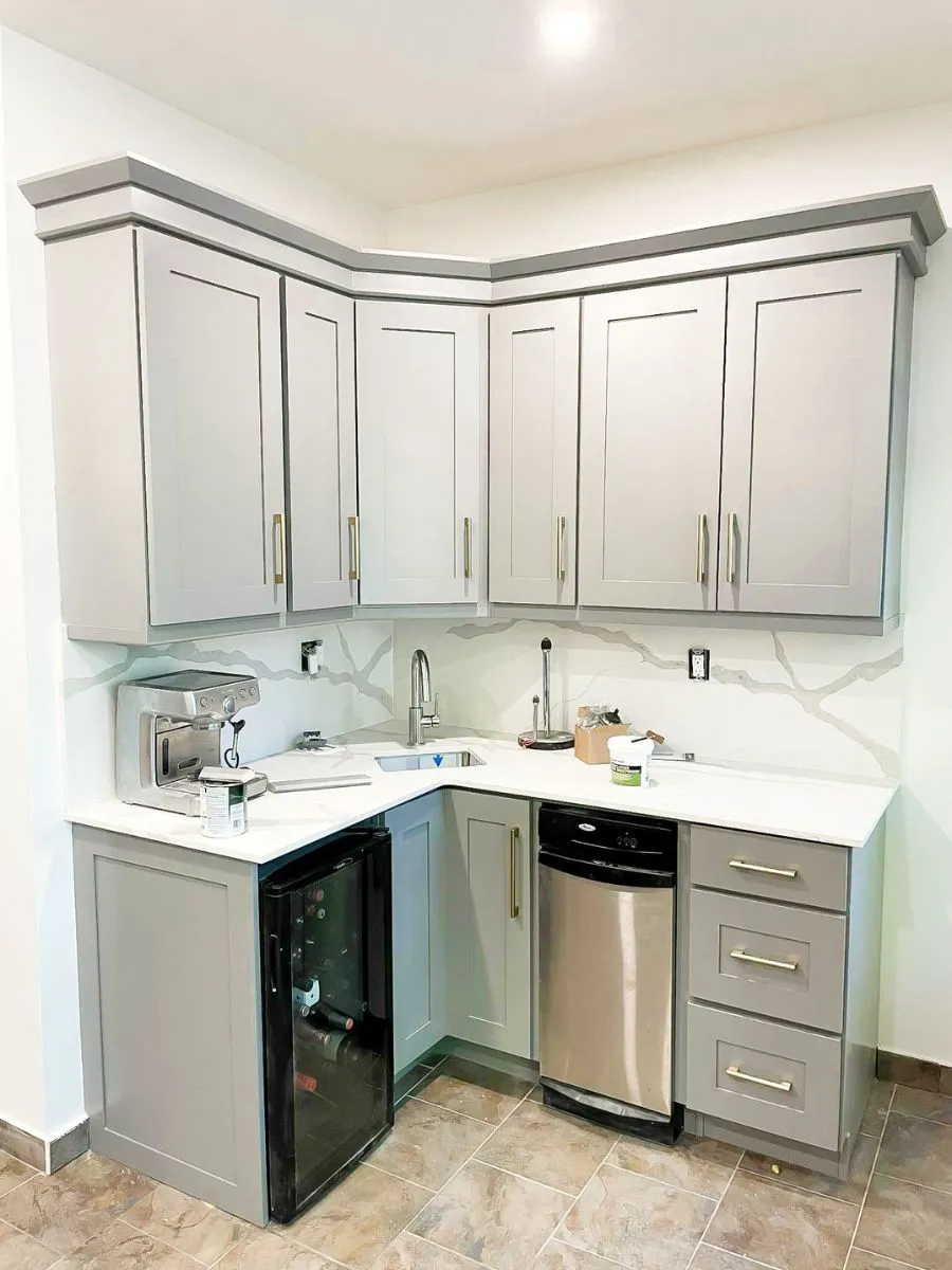 Renovated kitchen showcasing new backsplash and cabinets